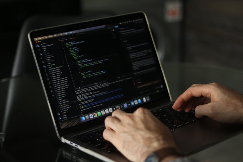 A close-up view of a computer screen displaying lines of source code in a text editor. The code includes syntax highlighting with different colours such as green, blue, purple, and red, indicating var